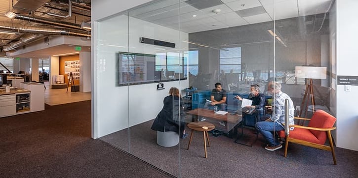 Team at WRNS Studio having a meeting using the Nureva HDL300 audio conferencing system