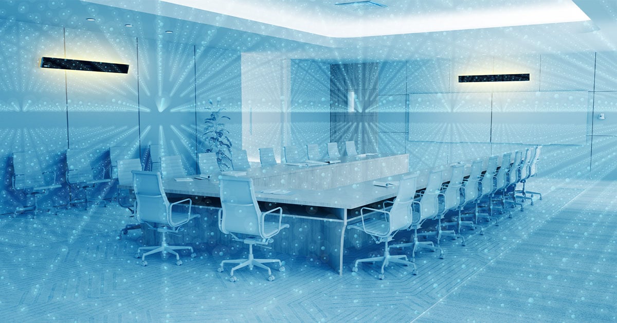 Modern conference room with a Nureva HDL410 audio conferencing system and a visualization of Nureva’s Microphone Mist technology for full-room microphone coverage.