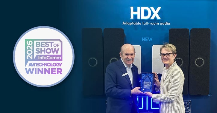 Graphic showcasing the Nureva HDX full-featured audio series winning a 2026 InfoComm Best of Show award. The left side includes the words: “HDX: Adaptable full-room audio” and the Best of Show award badge. On the right, Nureva founders David Martin and Nancy Knowlton hold the award in front of an HDX audio system.