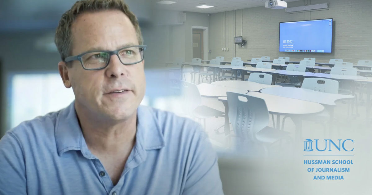 Gary Kayye of the University of North Carolina School of Journalism pictured alongside a Nureva-equipped hybrid classroom with flexible seating and a wall-mounted display.