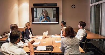 Hybrid meeting with several in-person faculty members and one remote professor