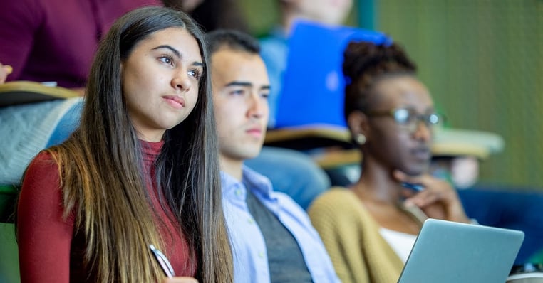 Students attend class in a HyFlex classroom