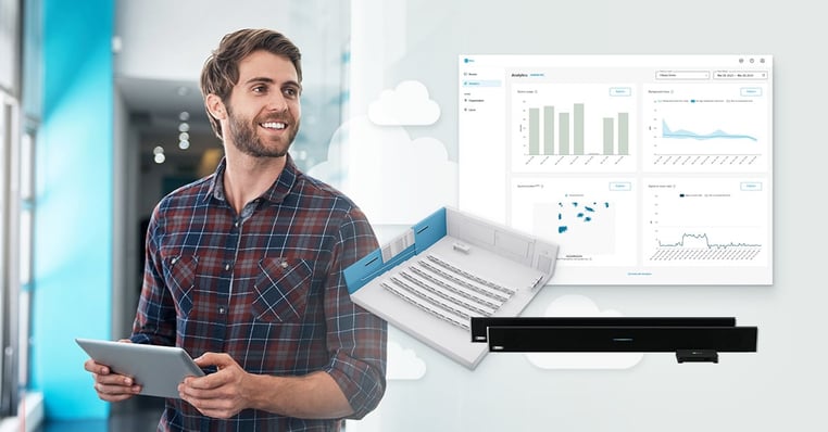 IT specialist alongside an image of new analytics charts available in Nureva Console
