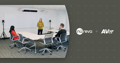 Three people in a meeting room demonstrating camera tracking with Nureva and AVer