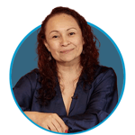 Female in a navy shirt smiling inside a blue circle.