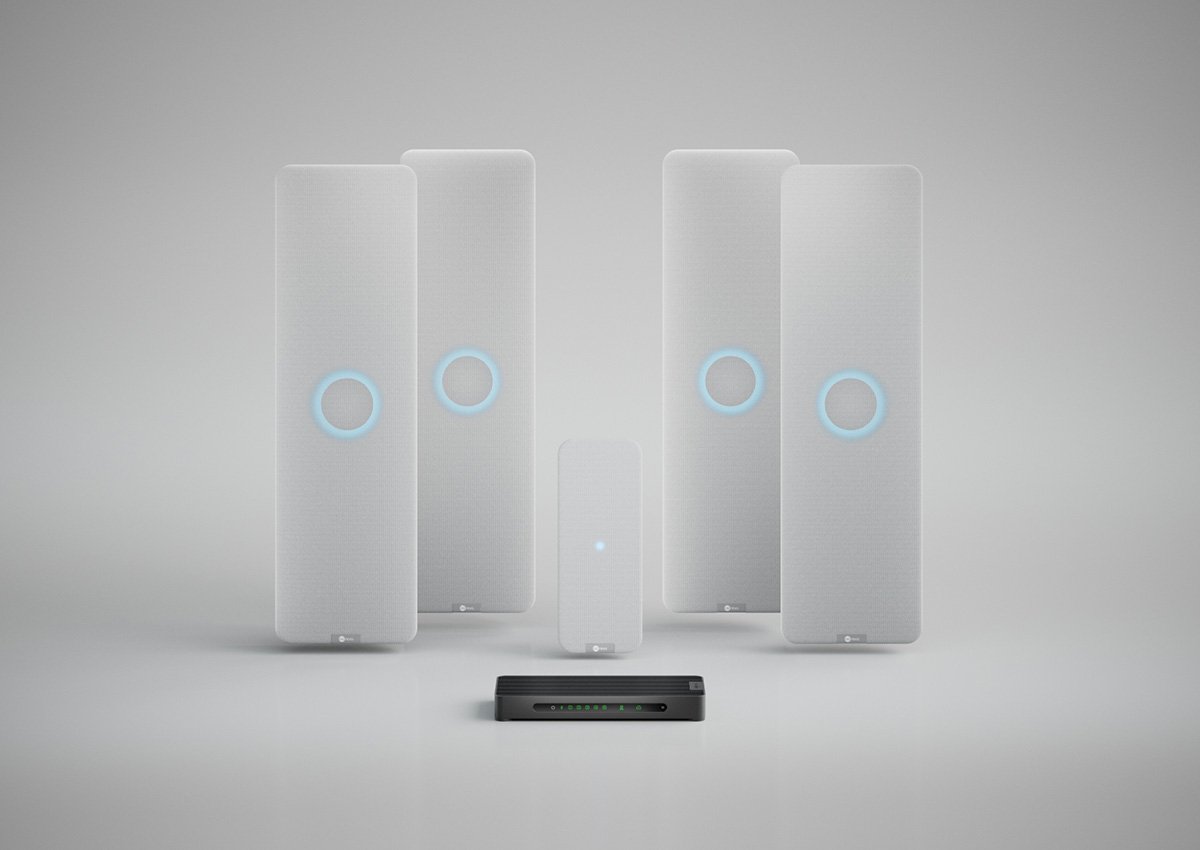 Nureva HDX system with four white audio bars, two white microphone pods and a system hub for large meeting spaces.