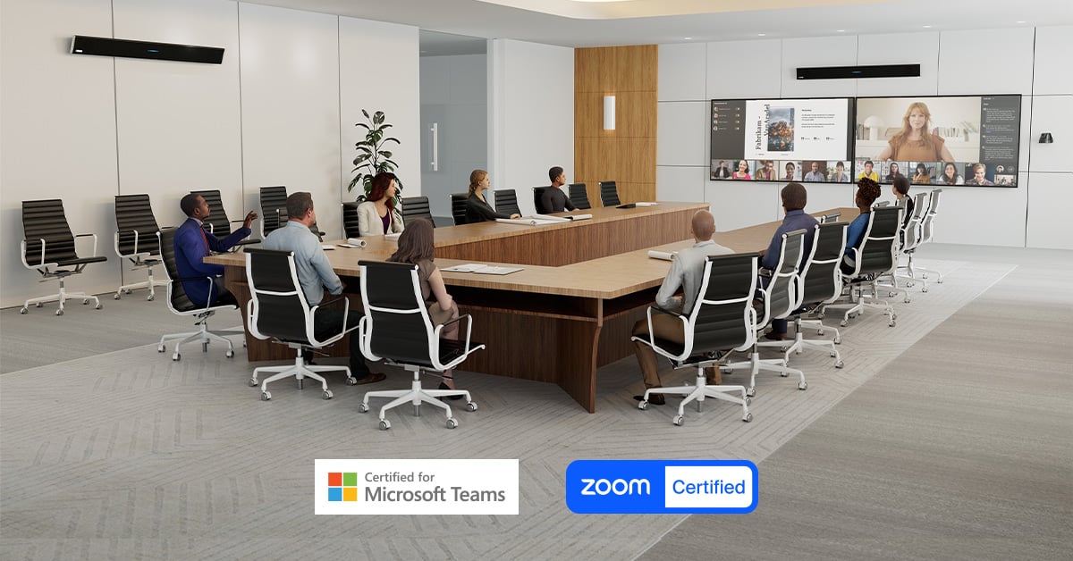 Large hybrid meeting room with dual Nureva HDL310 audio conferencing systems mounted above displays, certified for Microsoft Teams and Zoom for seamless collaboration.