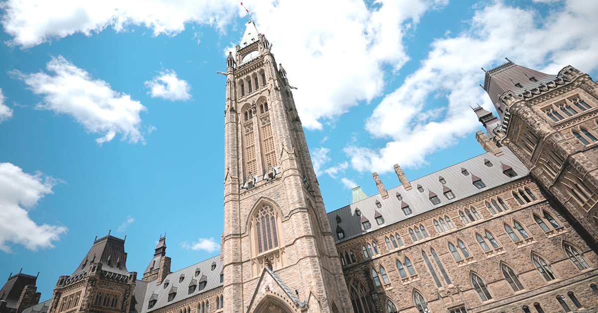 Parliament Hill in Ottawa with text highlighting Nureva’s trusted partnerships with Canadian government agencies for reliable audio in hybrid meetings.