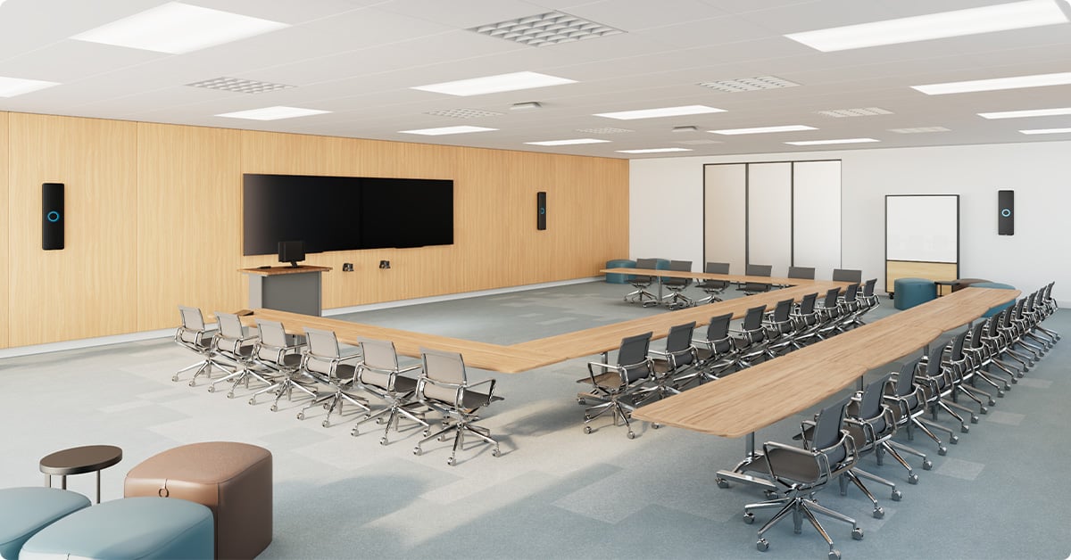 Modern training room with Nureva HDX in 4-bar, 2-pod setup for full-room mic coverage in hybrid learning and collaboration.