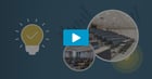 Watch the webinar replay on solving cost and complexity, shown with a tiered lecture hall and a classroom with rows of desks.