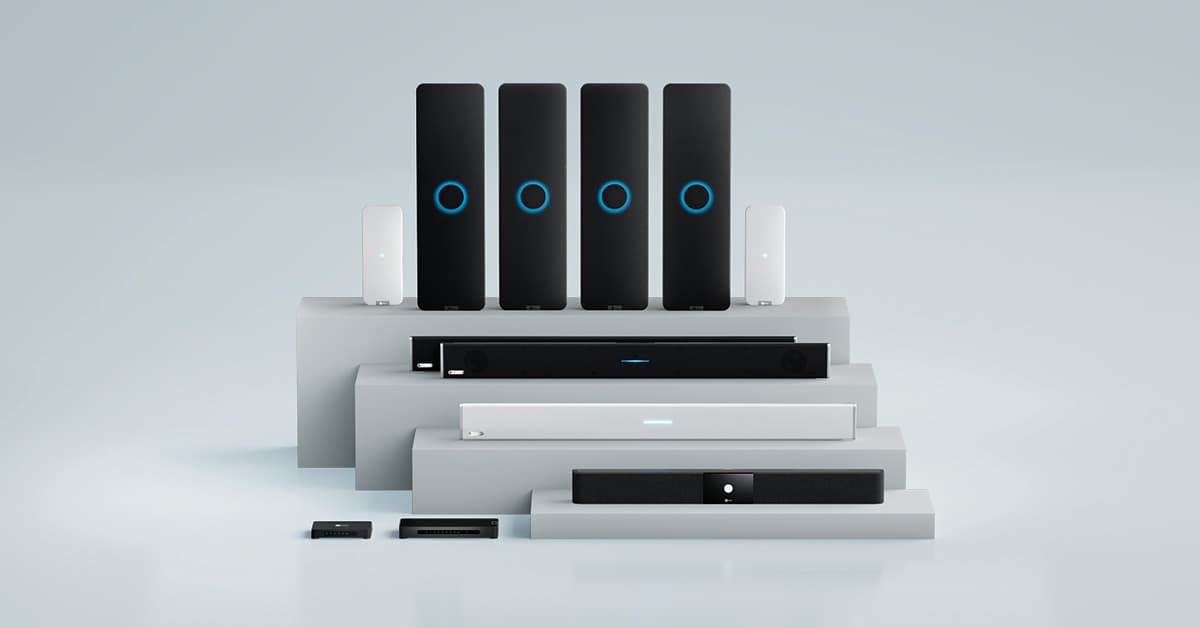 Lineup of Nureva audio bars and connect modules on stepped pedestals.