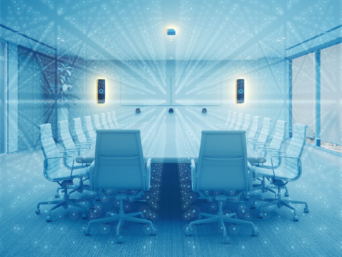 Nureva HDX audio bars and microphone pod in a meeting room filled with virtual microphones, illustrating full-room microphone coverage and Microphone Mist technology.