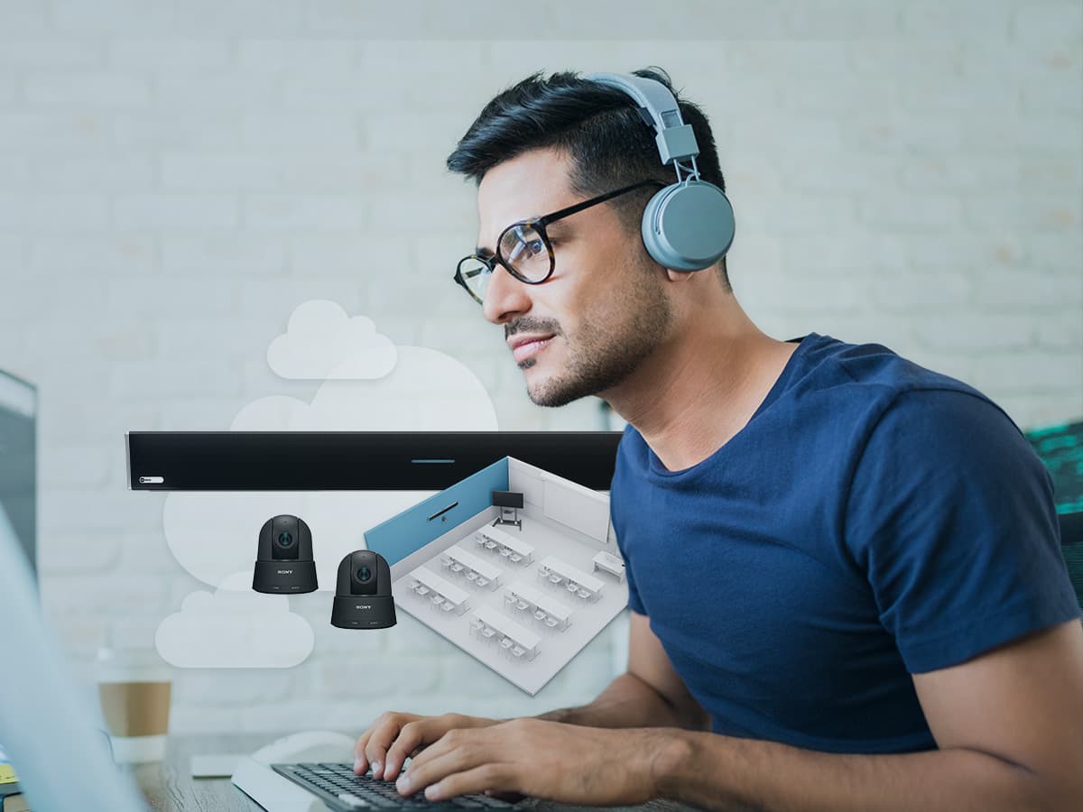 IT professional working at a laptop beside graphics of a Nureva microphone and speaker bar, cameras and a classroom layout, illustrating Nureva Developer Toolkit integrations.