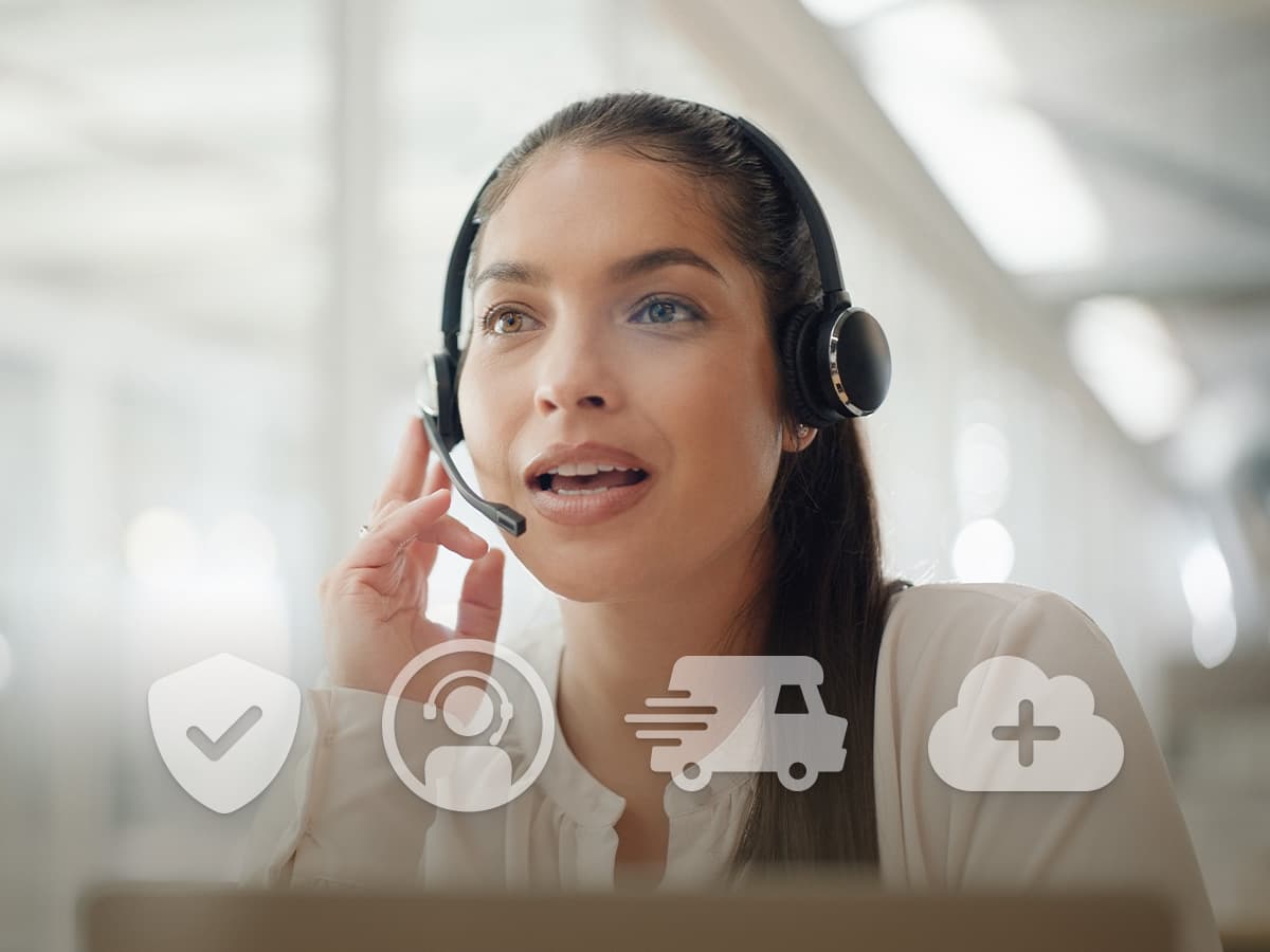 Support representative wearing a headset with icons illustrating Nureva Pro warranty coverage, technical support, advanced hardware replacement and enhanced management features.
