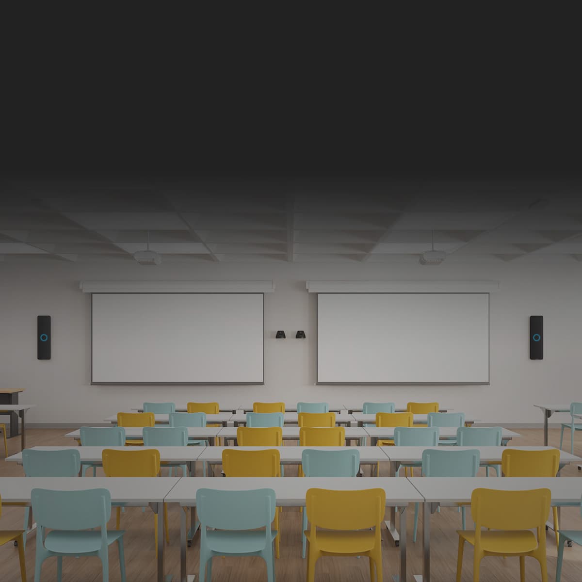 Bright colored large university classroom with colorful seating and Nureva HDX wall-mounted audio bars on each side.