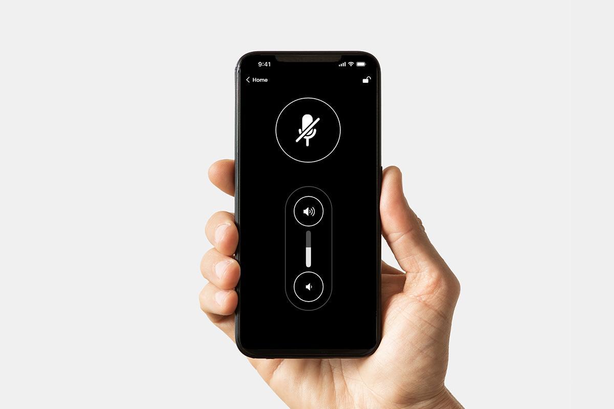 Nureva App device control screen on a smartphone with a mute toggle and speaker and microphone volume sliders.