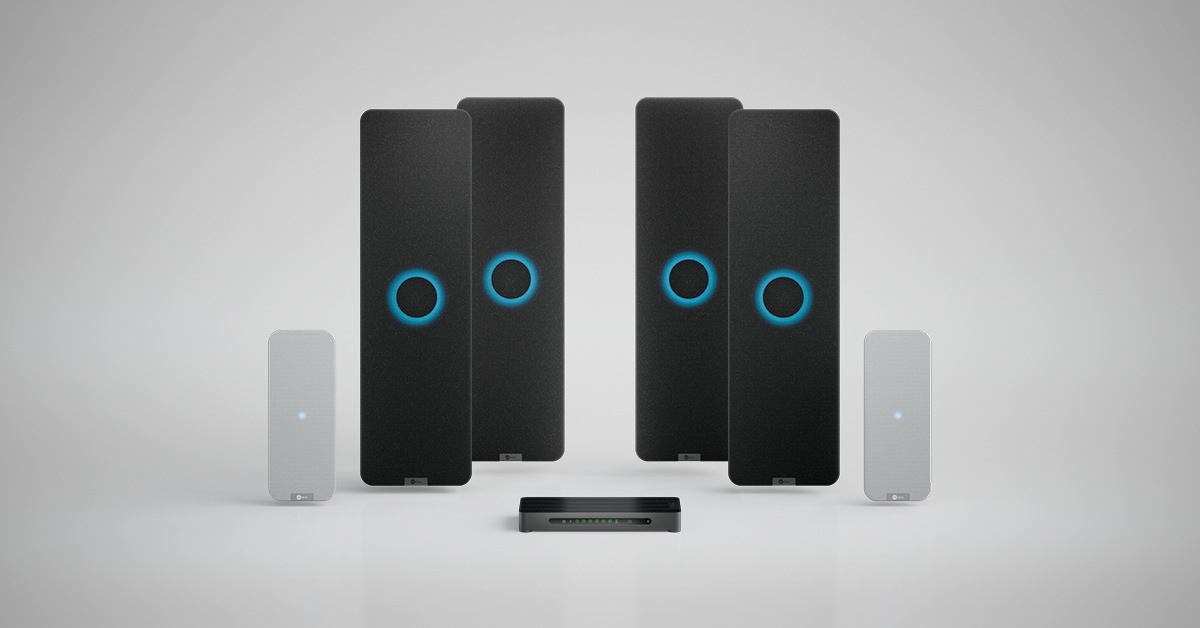 Nureva HDX system with four black audio bars, two white microphone pod and a system hub for large meeting spaces.