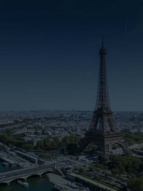 Aerial view of Paris with the Eiffel Tower prominently featured, representing the Nureva HDX on Tour stop in Paris.