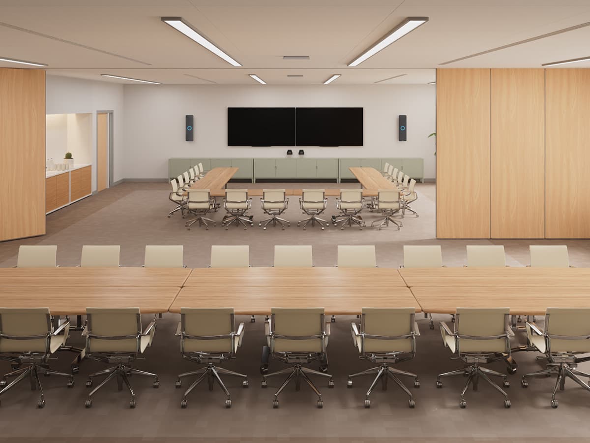 Large divisible meeting room with two separate table configurations and Nureva HDX mounted on the wall, set up for flexible hybrid collaboration.