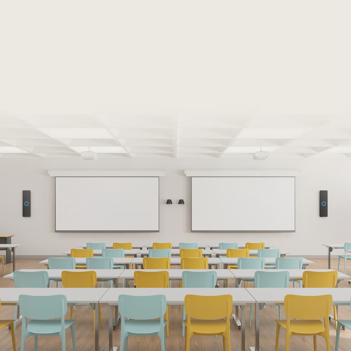 Bright large university classroom with colorful seating and Nureva HDX wall-mounted audio bars on each side.