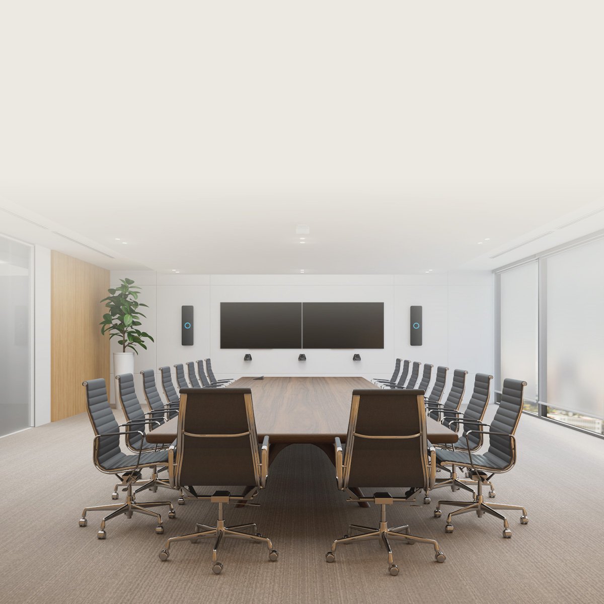 Spacious U-shaped corporate training room equipped with Nureva HDX audio system and dual display screens.