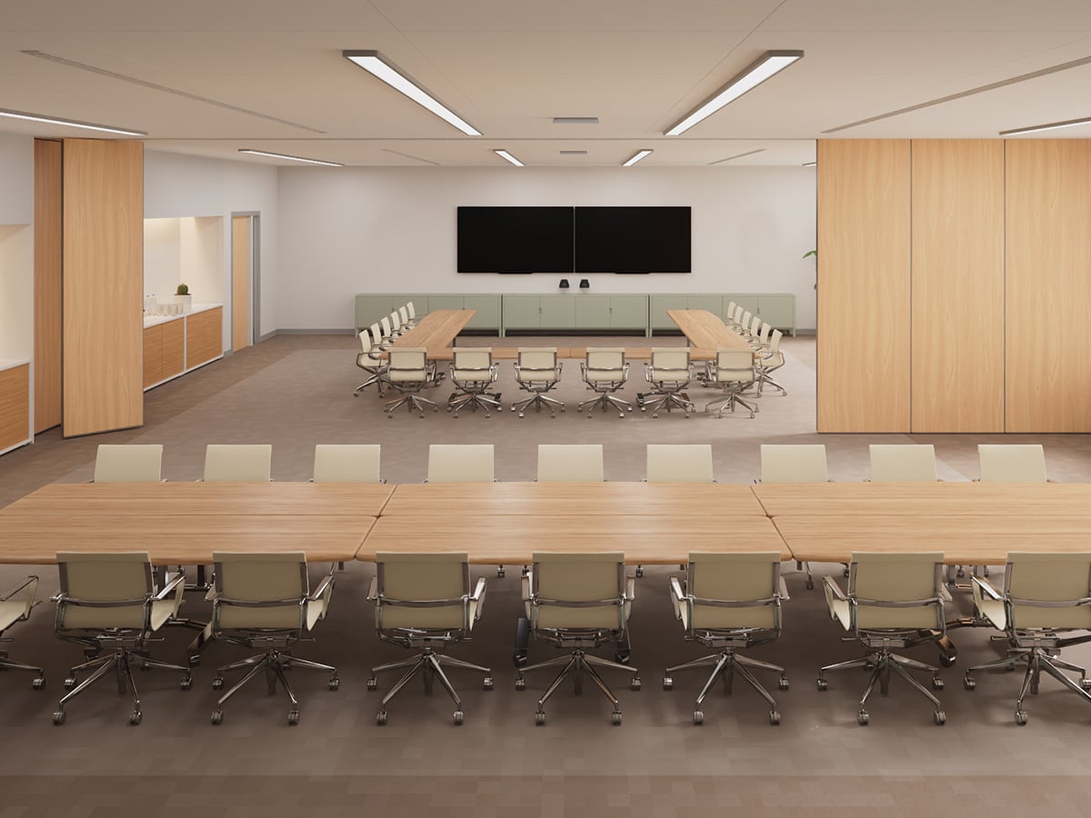 Large divisible meeting room with two separate table configurations and Nureva and Logitech hardware, set up for flexible hybrid collaboration.