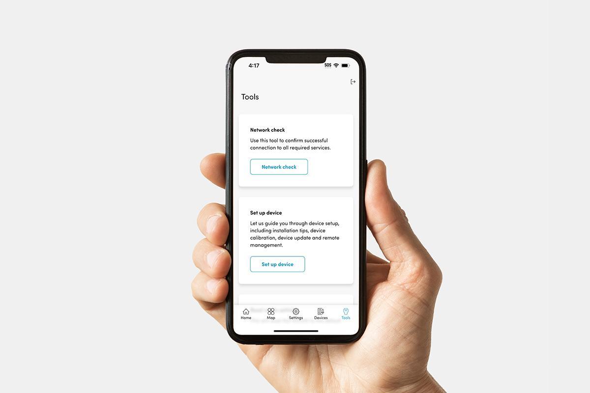 Nureva App interface on a smartphone showing the Tools page with options for network check and device setup, enabling users to confirm connectivity, calibrate devices, update firmware and manage audio systems remotely.