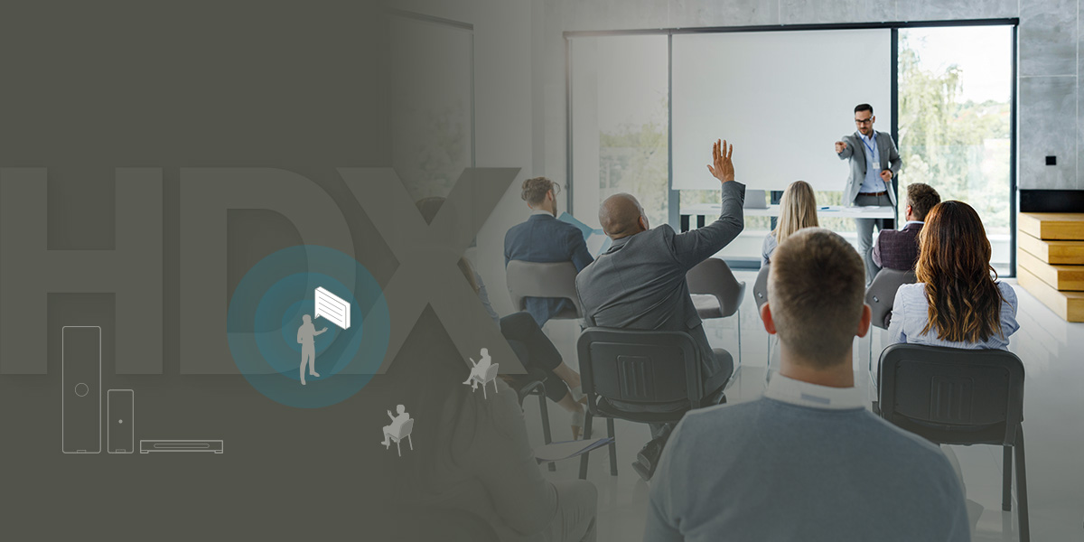 Graphic illustrating Nureva HDX series with Adaptive Voice Lift feature, showing a presenter speaking to an audience in a modern meeting room, enabling clear voice amplification for hybrid collaboration.