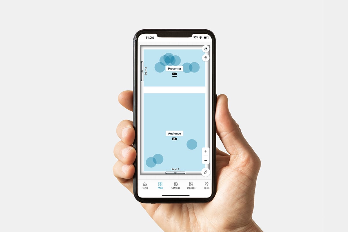 Nureva App interface on a smartphone displaying a coverage map with zones for presenter and audience, showing microphone pickup areas for optimizing audio in meeting or classroom spaces.