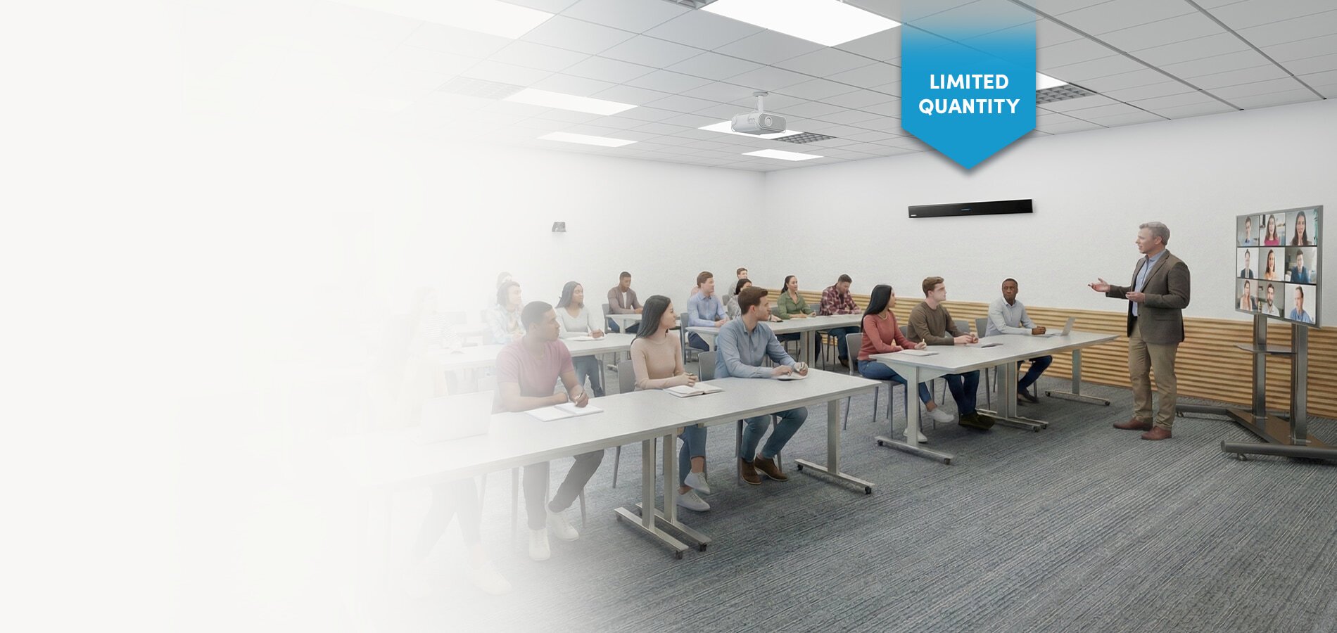 Hybrid classroom with students and a presenter using Nureva audio system technology, featuring an HDL310 microphone and speaker bar and a display connecting remote participants for an enhanced learning experience.