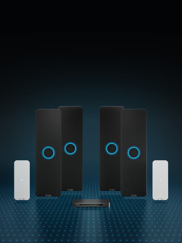 Nureva HDX audio system with two vertical rectangular black audio bars, each with an illuminated blue ring in the middle, two white microphone pods and the aluminum system hub. An overlay of blue dots represents Microphone Mist technology.