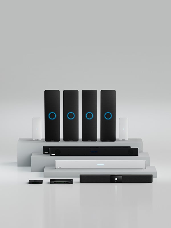 Full lineup of Nureva audio conferencing products including HDL and HDX series wall-mounted bars, microphone pods and system hubs displayed on a neutral background.